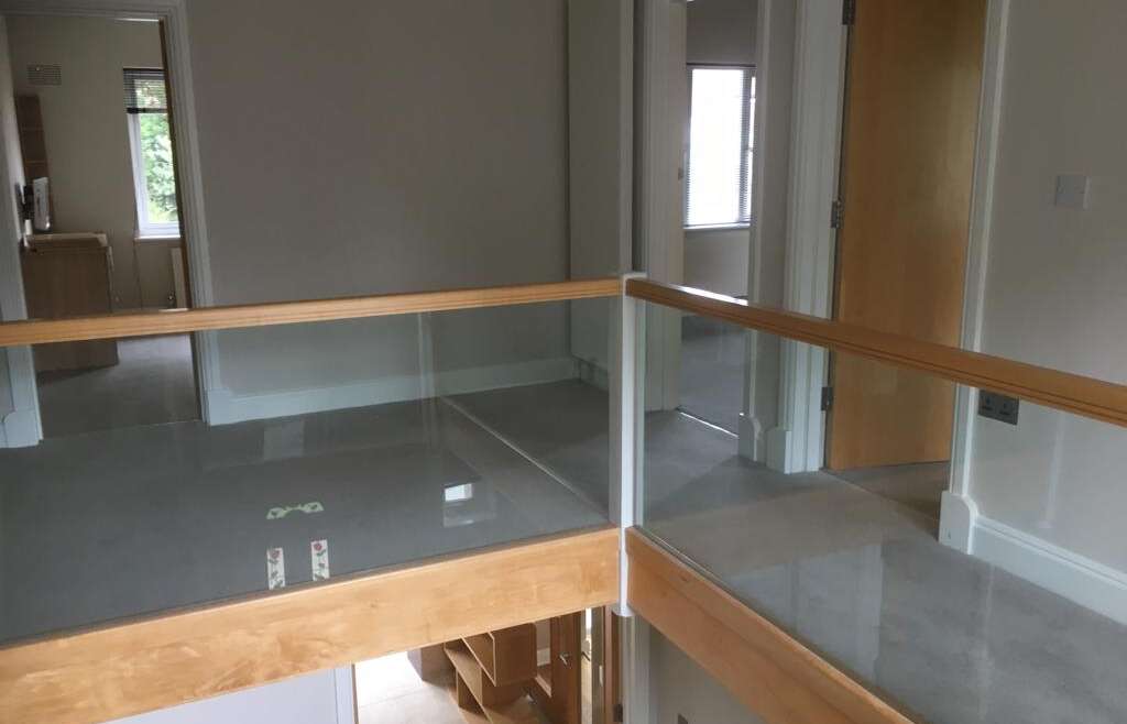 grey carpet glass stair rail